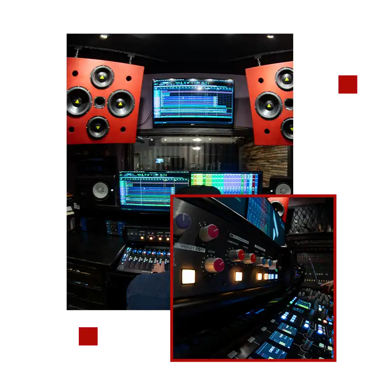 A professional music studio featuring large red speakers, multiple screens displaying audio software, and an advanced mixing console with glowing blue lights.